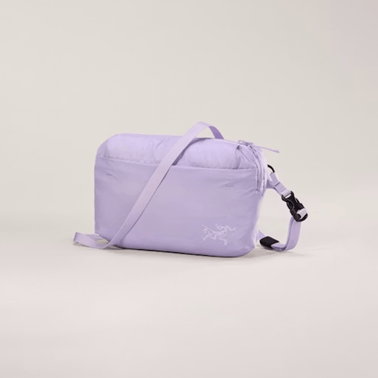 Purple crossbody bag with a visible brand logo on a light gray background