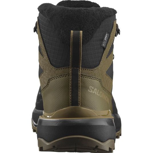 Back view of a green and black hiking boot with visible brand logo on a white background