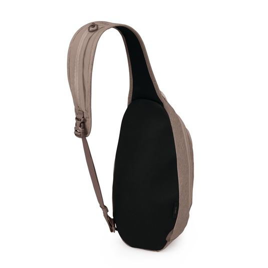 Black sling bag with brown strap on a white background