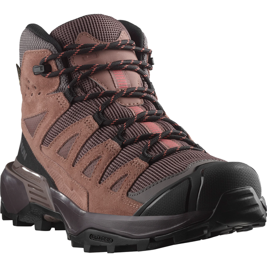 Brown hiking boot with black laces on a white background