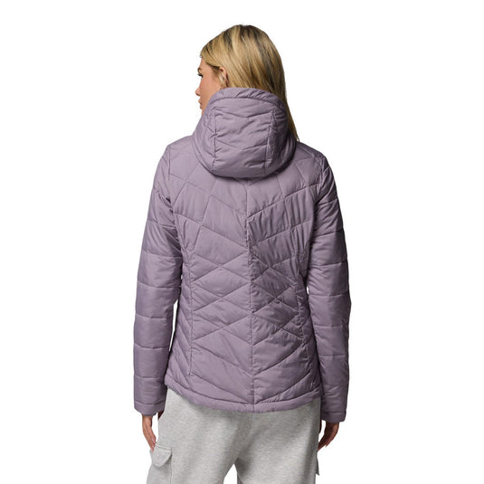 Person wearing a purple quilted jacket on a white background