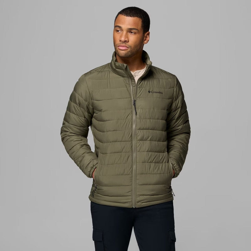 Load image into Gallery viewer, Man wearing a green puffer jacket with Columbia logo on a gray background
