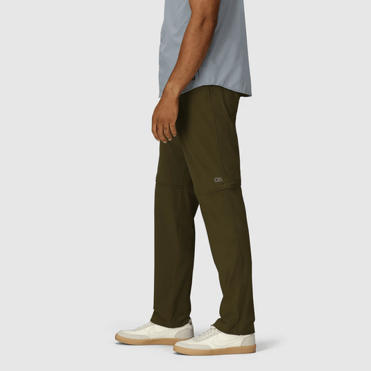 Person wearing olive green pants with a light gray shirt on a white background