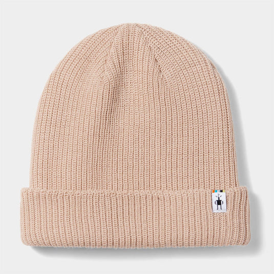 Beige knit beanie with a small label on a light gray background