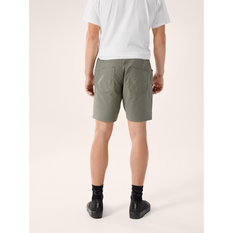 Load image into Gallery viewer, Person wearing olive green shorts on a white background
