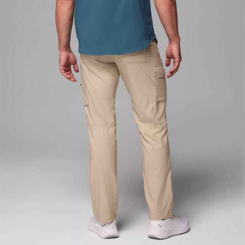 Load image into Gallery viewer, Person wearing beige cargo pants and a blue shirt on a gray background
