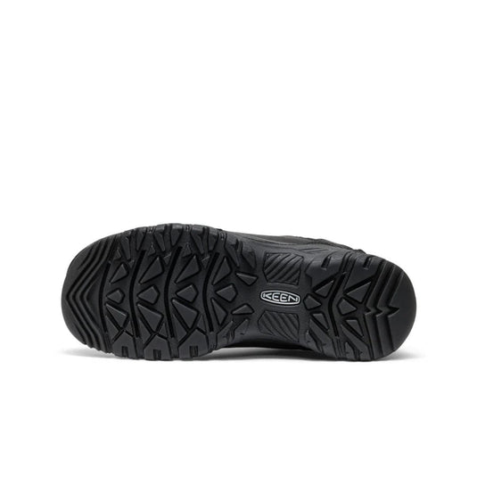 Black shoe with a prominent sole on a white background