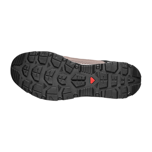 Close-up of a shoe sole with a red logo on a white background
