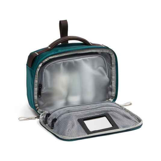 Open teal toiletry bag with interior compartments on a white background