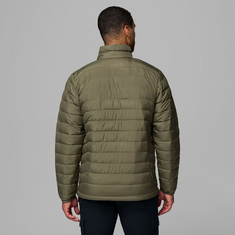 Load image into Gallery viewer, Person wearing a green puffer jacket on a gray background

