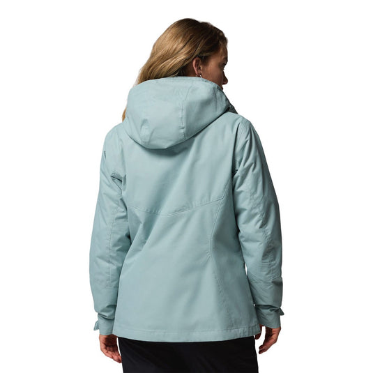 Person wearing a light blue jacket on a white background