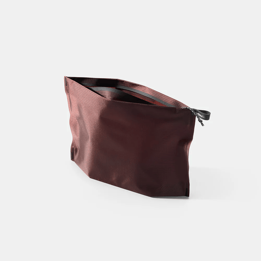 Brown textured pouch with a zipper on a white background