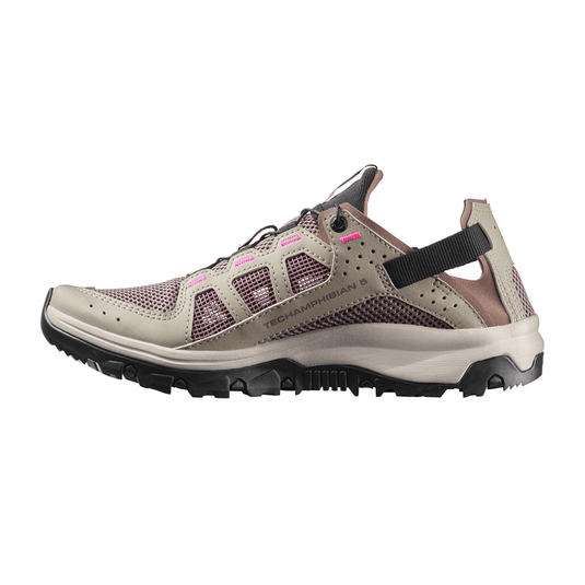 Hiking shoe with mesh design and black sole on a white background