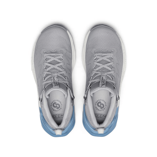 Gray athletic shoes with blue soles on a white background
